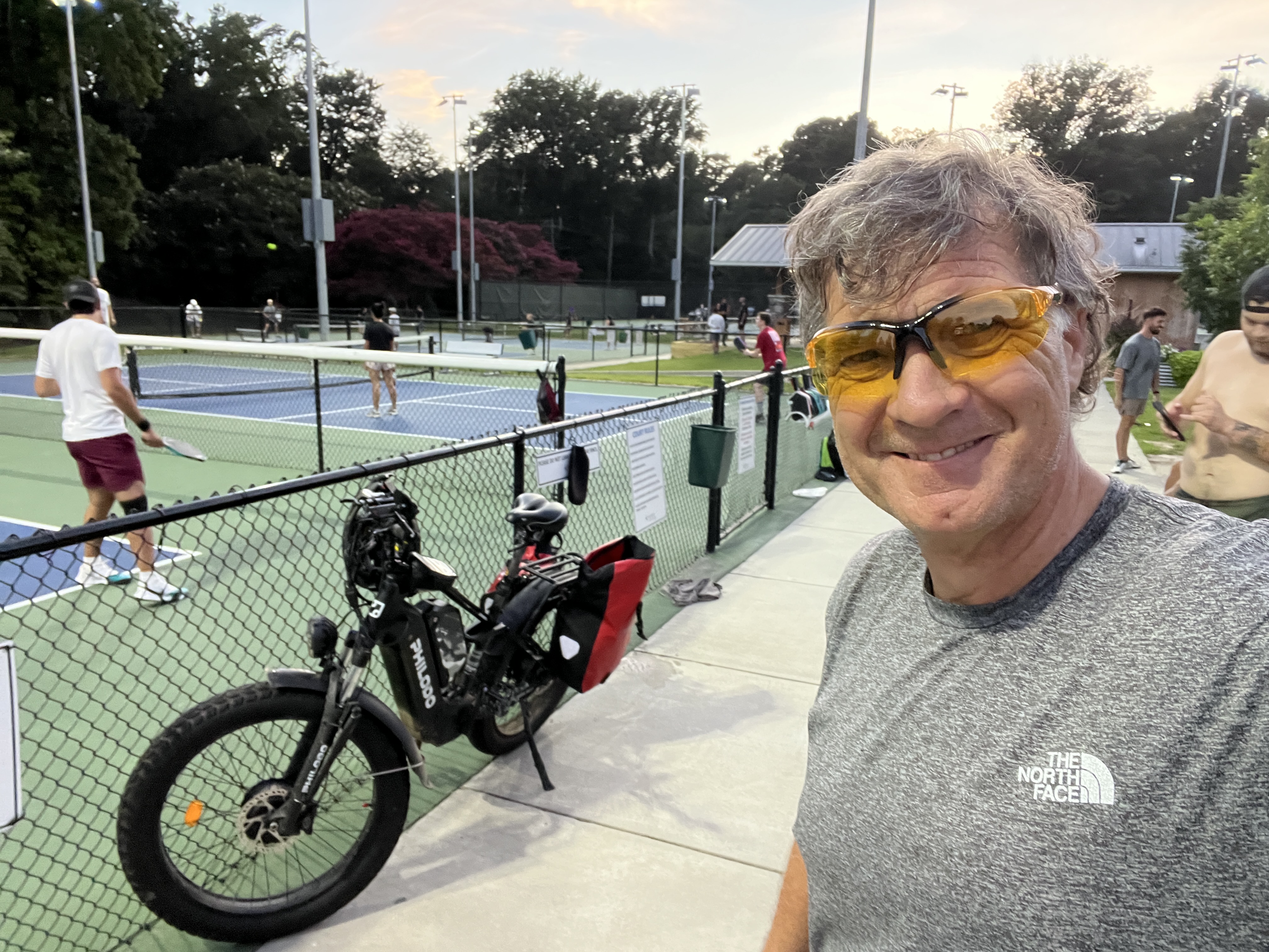 Rick at the pickleball courts with his bike